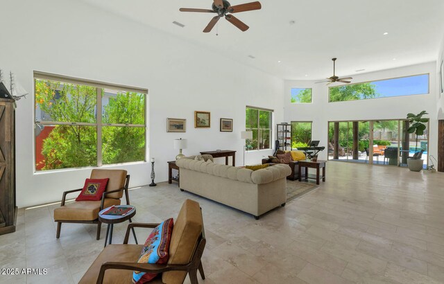 3611 E Ahwatukee Dr, Phoenix, AZ 85044 - living area featuring a ceiling fan, a high ceiling, and recessed lighting