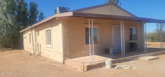 view of side of home featuring central air condition unit