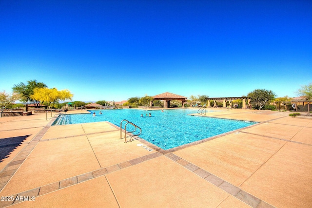 community pool featuring a pergola, a patio, and a gazebo