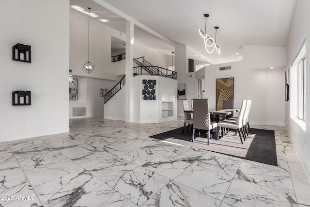 dining room with a high ceiling