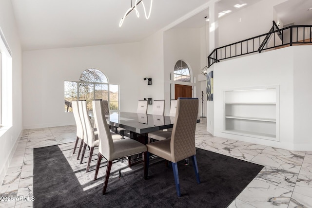 dining room with a high ceiling