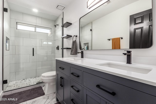 bathroom featuring walk in shower, vanity, and toilet