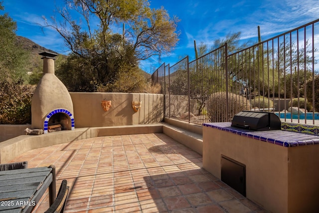 view of patio featuring area for grilling and a mountain view