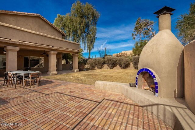 view of patio / terrace featuring ceiling fan