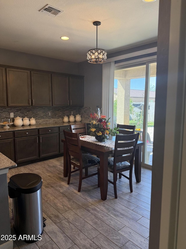 10236 W Wood St, Tolleson, AZ 85353 - dining area featuring light wood-type flooring and recessed lighting