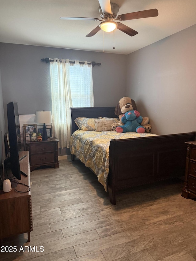 10236 W Wood St, Tolleson, AZ 85353 - bedroom with light wood-style flooring and ceiling fan