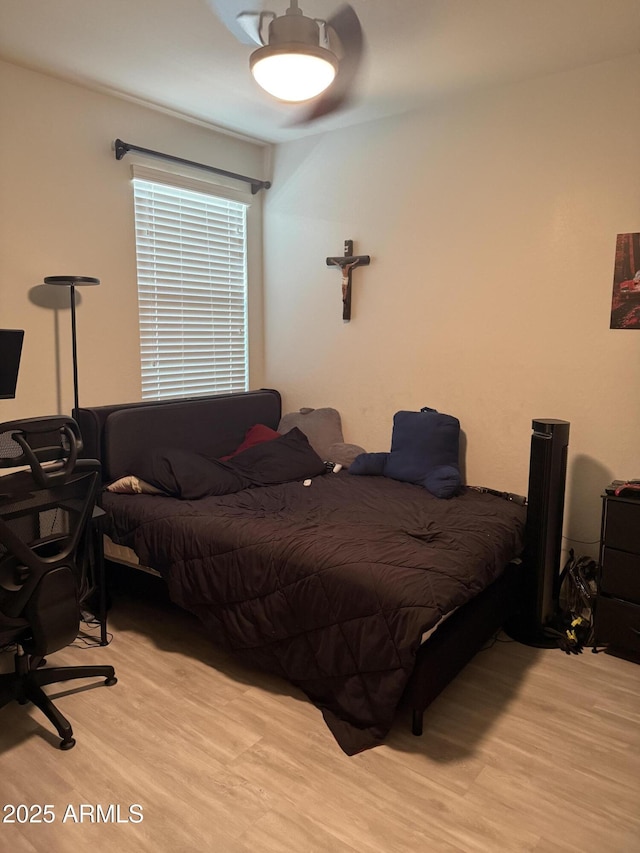 10236 W Wood St, Tolleson, AZ 85353 - bedroom with light wood-style floors and a ceiling fan