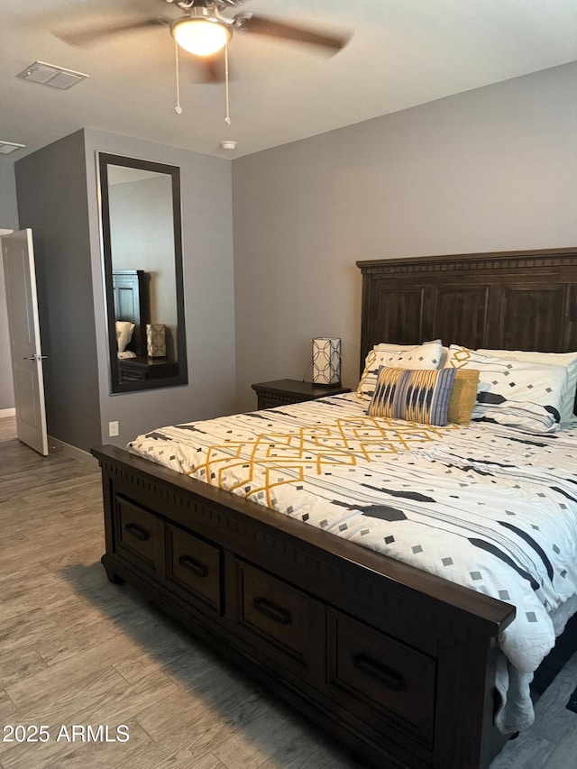 10236 W Wood St, Tolleson, AZ 85353 - bedroom with light wood-style flooring, baseboards, and a ceiling fan