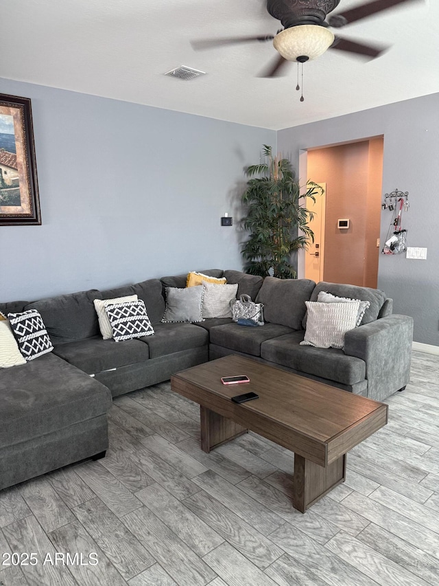 10236 W Wood St, Tolleson, AZ 85353 - living area with wood finished floors and a ceiling fan