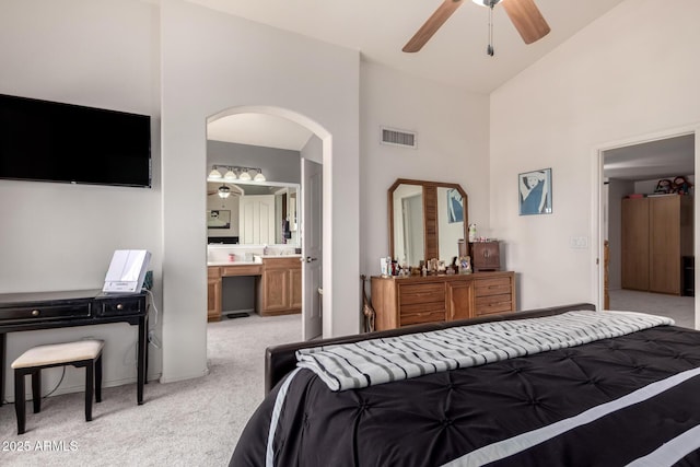 7460 E Kiowa Ave, Mesa, AZ 85209 - bedroom featuring light colored carpet, arched walkways, high vaulted ceiling, ensuite bathroom, and a ceiling fan