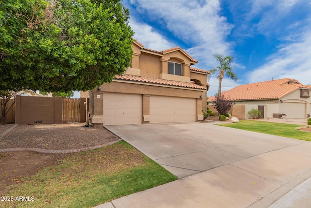 7460 E Kiowa Ave, Mesa, AZ 85209 - mediterranean / spanish home with stucco siding, a garage, concrete driveway, and a tile roof
