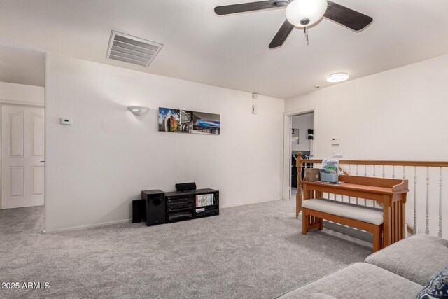 7460 E Kiowa Ave, Mesa, AZ 85209 - living room with carpet floors and a ceiling fan