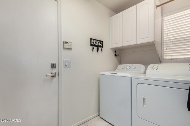 7460 E Kiowa Ave, Mesa, AZ 85209 - laundry room with cabinet space, washing machine and clothes dryer, and light tile patterned floors