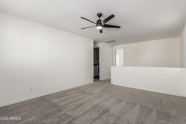 empty room featuring light colored carpet and ceiling fan