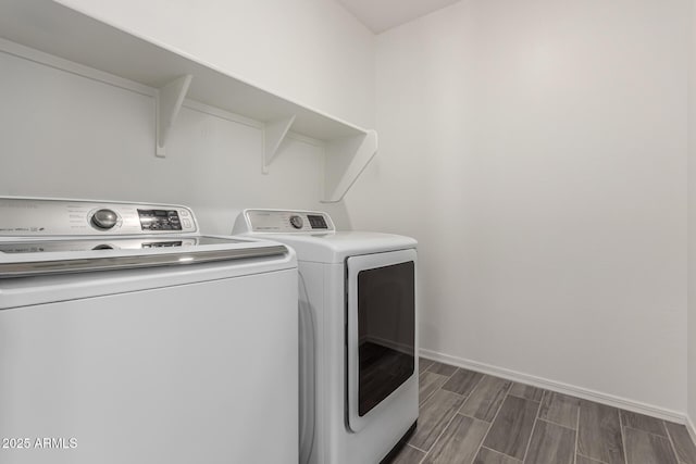 clothes washing area featuring washing machine and clothes dryer