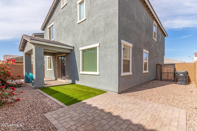 rear view of house featuring a patio