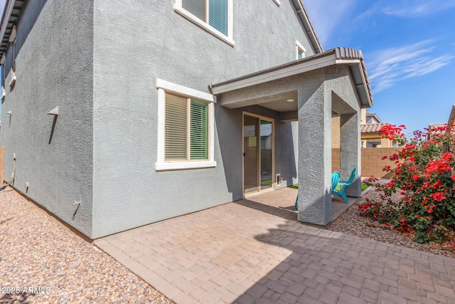 rear view of house featuring a patio