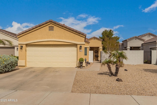 view of front of home featuring stucco siding, driveway, fence, a garage, and a tiled roof