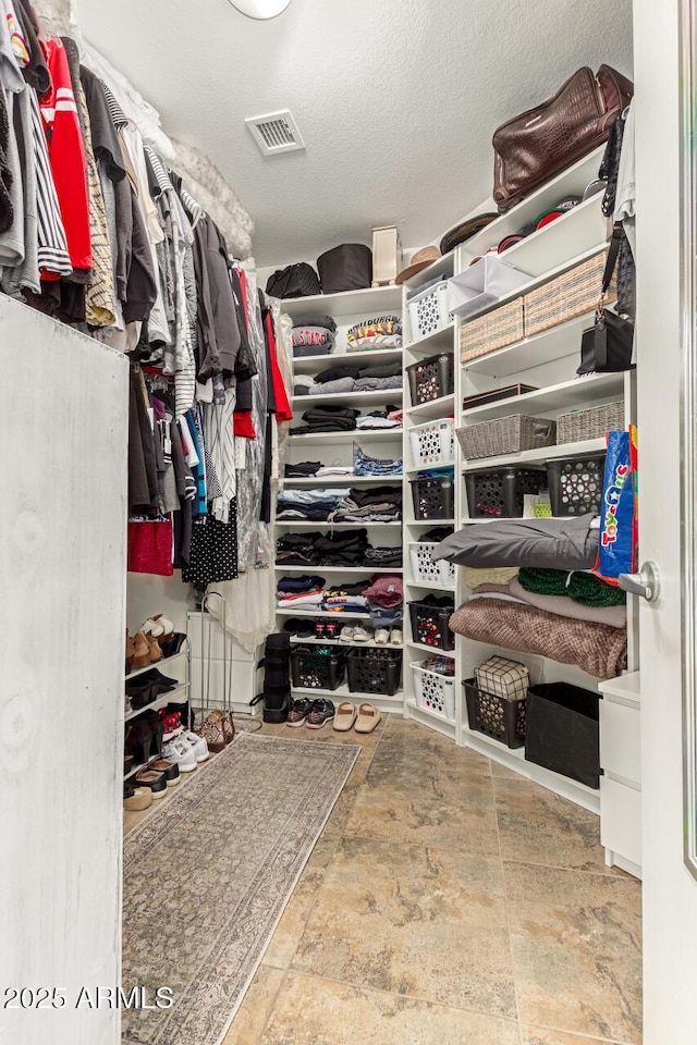 walk in closet featuring visible vents