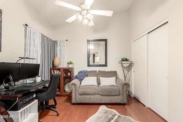 office with a ceiling fan and wood finished floors