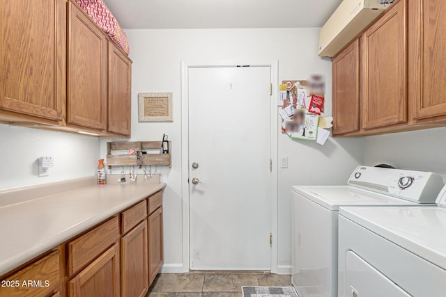 laundry area with cabinet space and separate washer and dryer