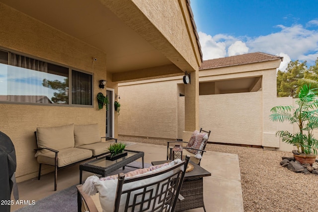 view of patio / terrace featuring an outdoor hangout area and fence