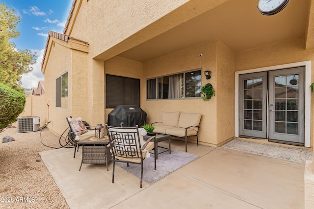 view of patio with area for grilling, an outdoor hangout area, central AC unit, and fence