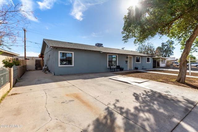 ranch-style home with a patio