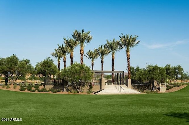 view of home's community featuring a lawn