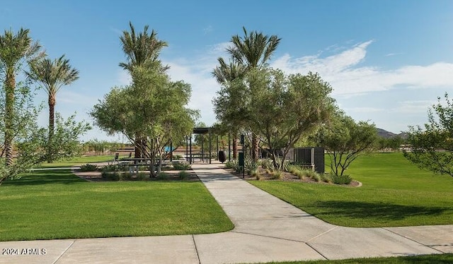 view of home's community featuring a lawn