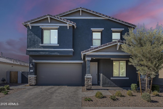 9352 E Saturn Ave, Mesa, AZ 85212 - view of front facade with a garage, stucco siding, decorative driveway, and a tiled roof
