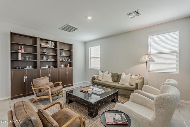 9352 E Saturn Ave, Mesa, AZ 85212 - living room featuring baseboards and light tile patterned floors