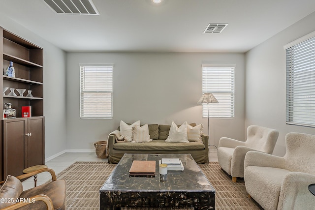 9352 E Saturn Ave, Mesa, AZ 85212 - living area with plenty of natural light, baseboards, and tile patterned flooring