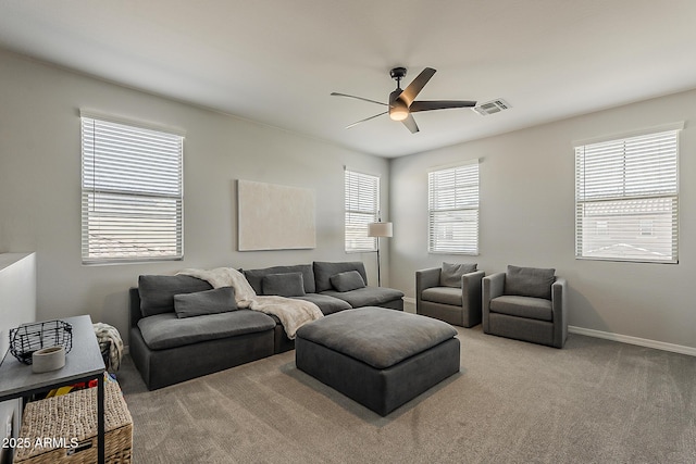 9352 E Saturn Ave, Mesa, AZ 85212 - carpeted living room featuring ceiling fan and baseboards