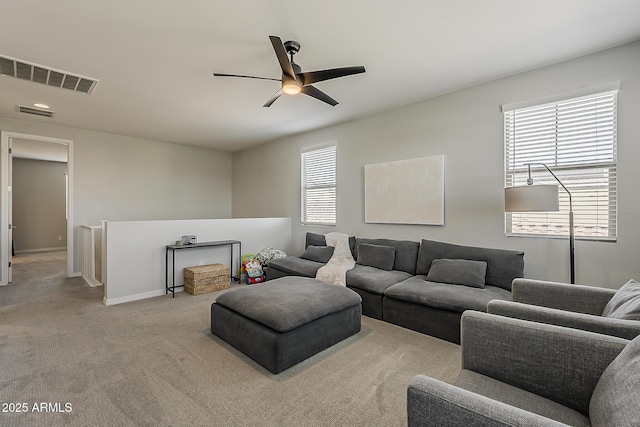 9352 E Saturn Ave, Mesa, AZ 85212 - living area with a ceiling fan, carpet floors, and baseboards