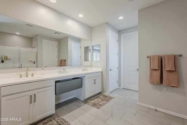 9352 E Saturn Ave, Mesa, AZ 85212 - full bathroom featuring double vanity, a stall shower, baseboards, and recessed lighting