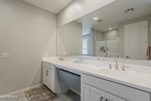 9352 E Saturn Ave, Mesa, AZ 85212 - full bath with double vanity, a stall shower, baseboards, and tile patterned flooring
