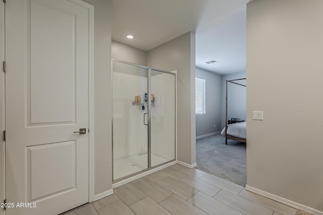 9352 E Saturn Ave, Mesa, AZ 85212 - bathroom featuring a stall shower, ensuite bath, and baseboards