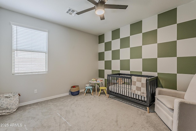 9352 E Saturn Ave, Mesa, AZ 85212 - bedroom with light colored carpet, baseboards, a nursery area, and a ceiling fan
