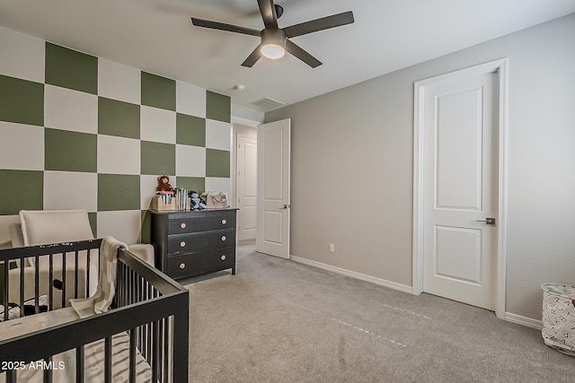 9352 E Saturn Ave, Mesa, AZ 85212 - bedroom featuring light carpet, a nursery area, baseboards, and ceiling fan