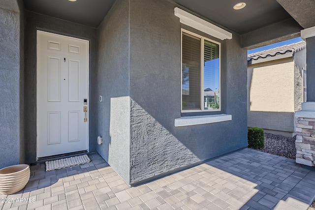 9352 E Saturn Ave, Mesa, AZ 85212 - view of exterior entry featuring stucco siding