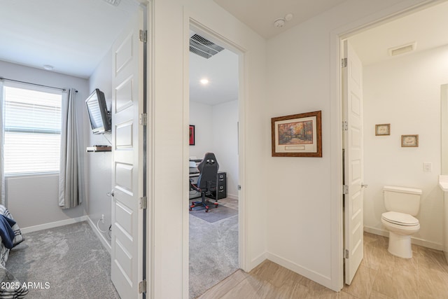 2929 E Mohave Ln, Apache Junction, AZ 85119 - hallway featuring a desk and baseboards