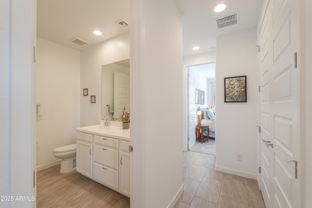 2929 E Mohave Ln, Apache Junction, AZ 85119 - ensuite bathroom with vanity, recessed lighting, and wood finish floors