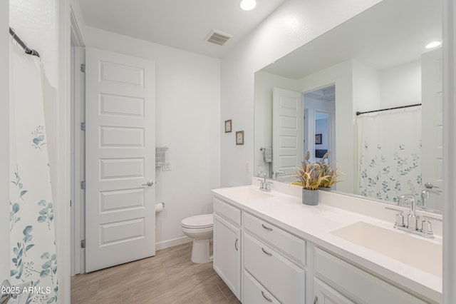 2929 E Mohave Ln, Apache Junction, AZ 85119 - full bathroom with double vanity, wood finished floors, and recessed lighting