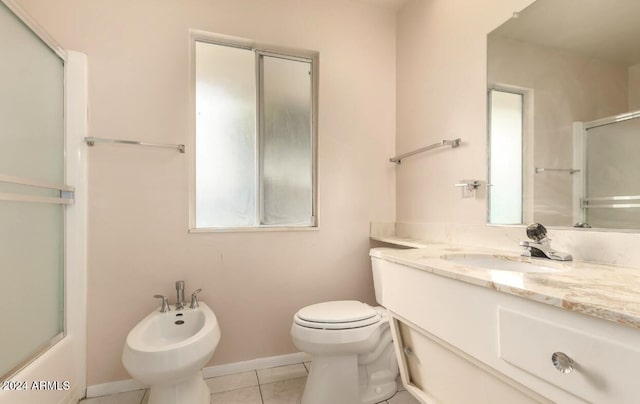 bathroom featuring a bidet, vanity, toilet, and tile patterned flooring