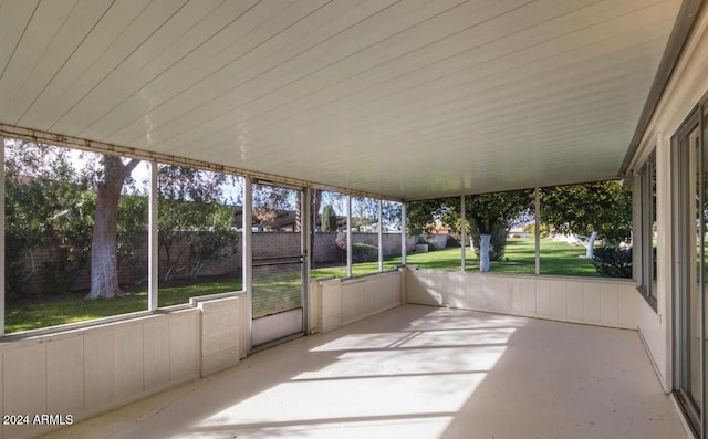 unfurnished sunroom featuring a healthy amount of sunlight