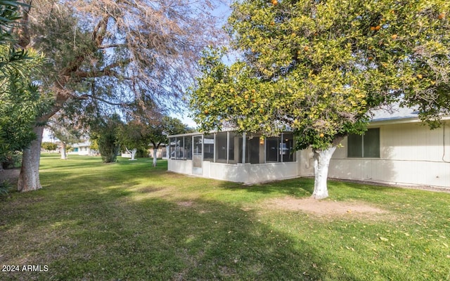 view of yard with a sunroom