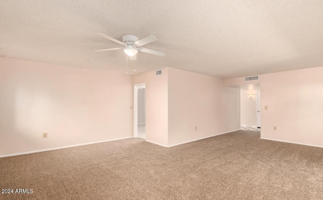 carpeted empty room with a textured ceiling and ceiling fan