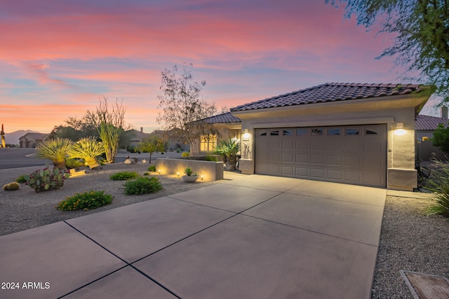 view of front of property with a garage