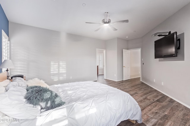 bedroom featuring dark hardwood / wood-style floors and ceiling fan